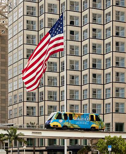 united states Centrale bus passing through on bridge near USA flag miami